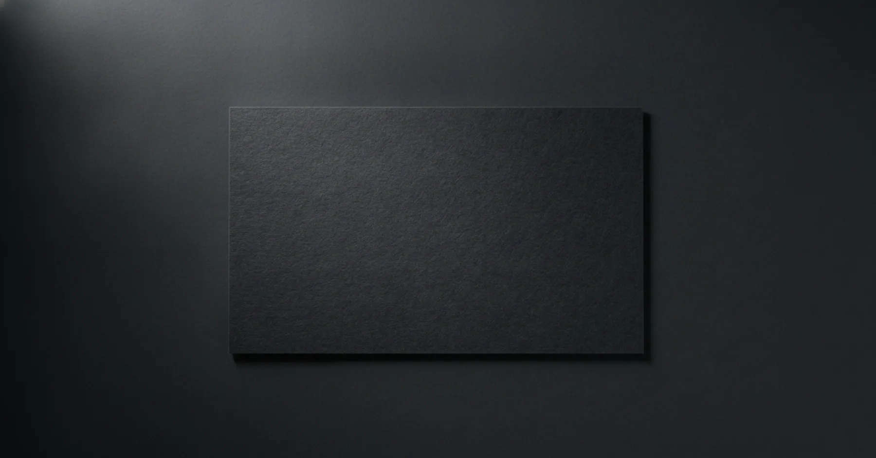 A black Caviar Pixels business card.